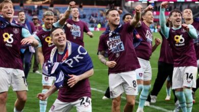 Burnley and Leeds United Secure Premier League Promotion in Thrilling Championship Finale 5 A jubilant burnley squad celebrates their promotion at Elland Road.